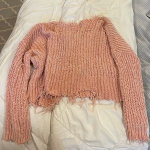 Pink brand new cute sweater with fringe on bottom and v in back